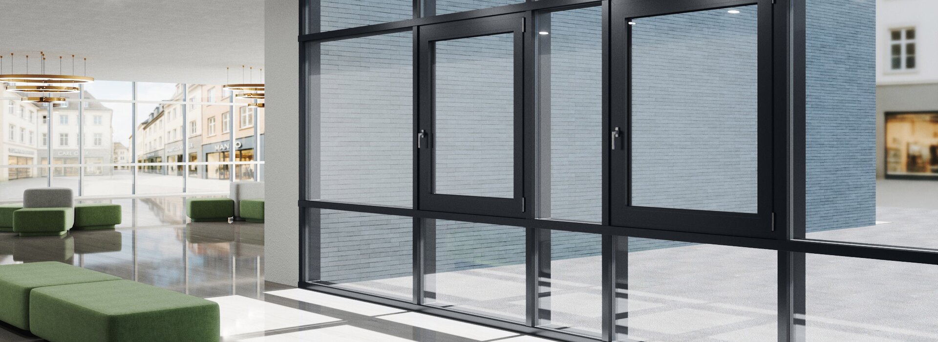 Moderner Empfangsbereich mit großen Aluminiumfenstern und grünen Sitzbänken